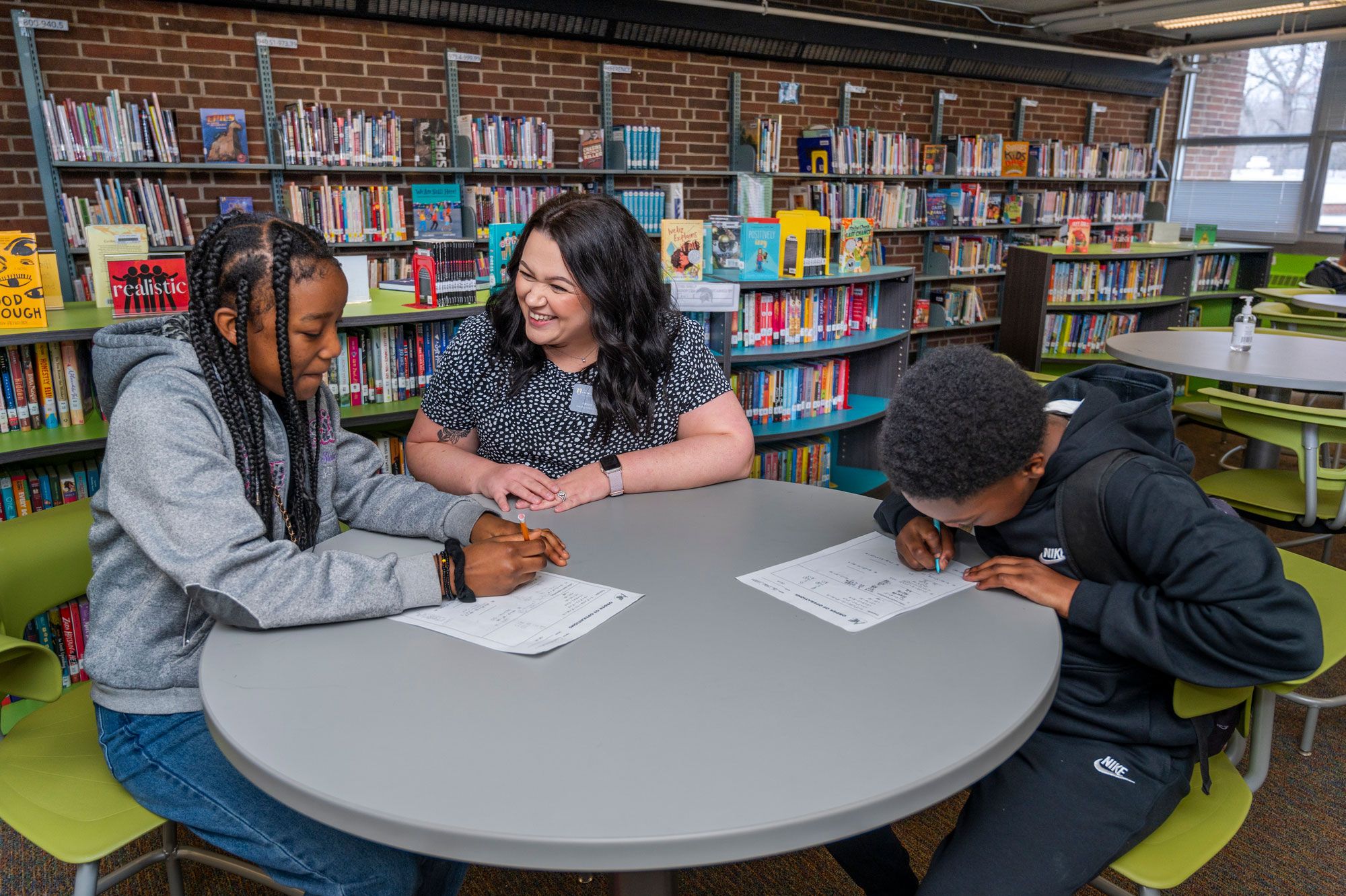 Tutor working with students